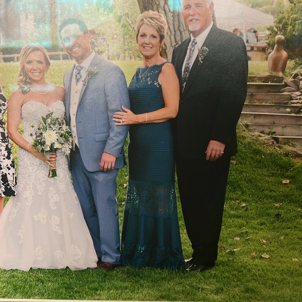 Mother of the groom gown in teal green with lace detail